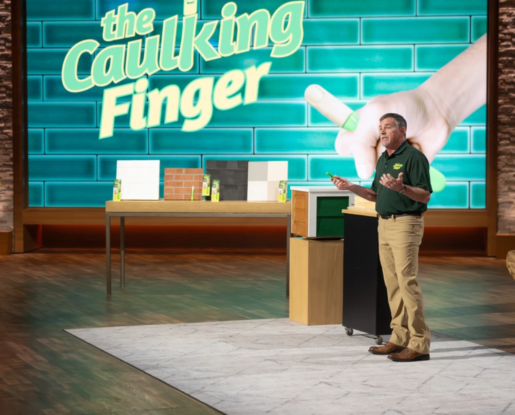 The Caulking Finger logo